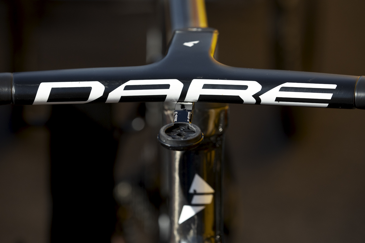 Tour of Britain 2024 - UNO-X Mobility team bike sponsor Dare printed on the handlebars