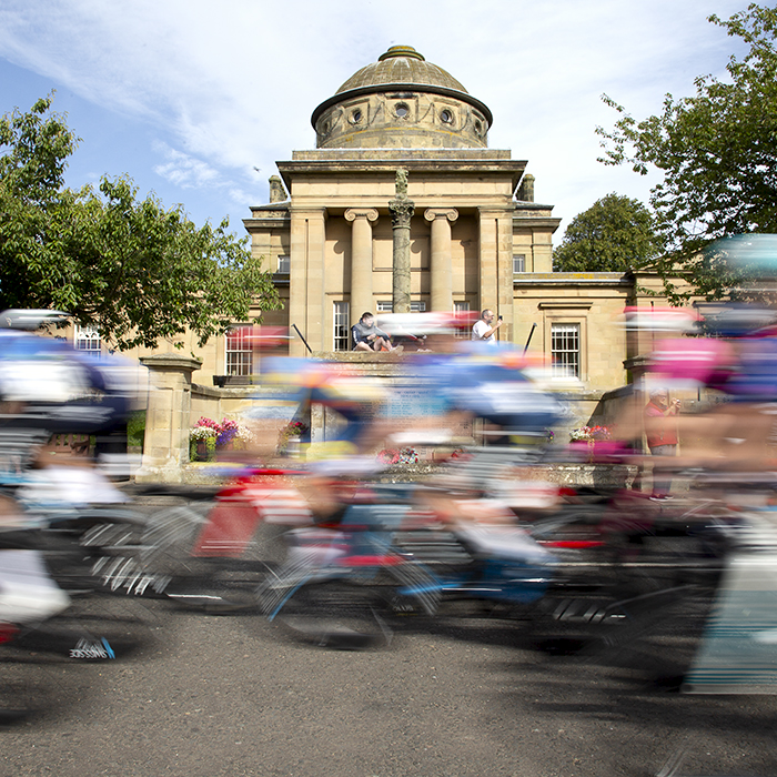 Tour of Britain 2024 - The race speeds past Greenlaw Town Hall in the Scottish Borders