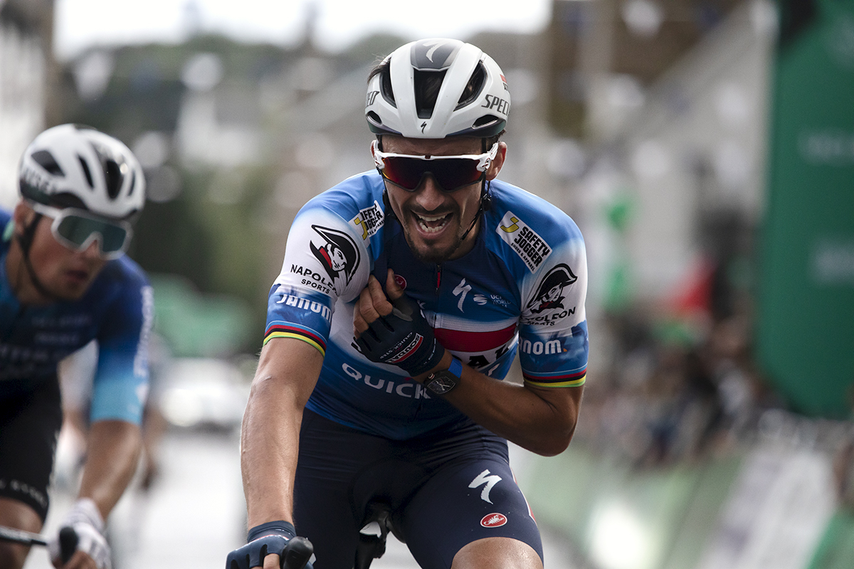 Tour of Britain 2024 - A joyous Julian Alaphilippe talks into his team radio following their victory in Kelso