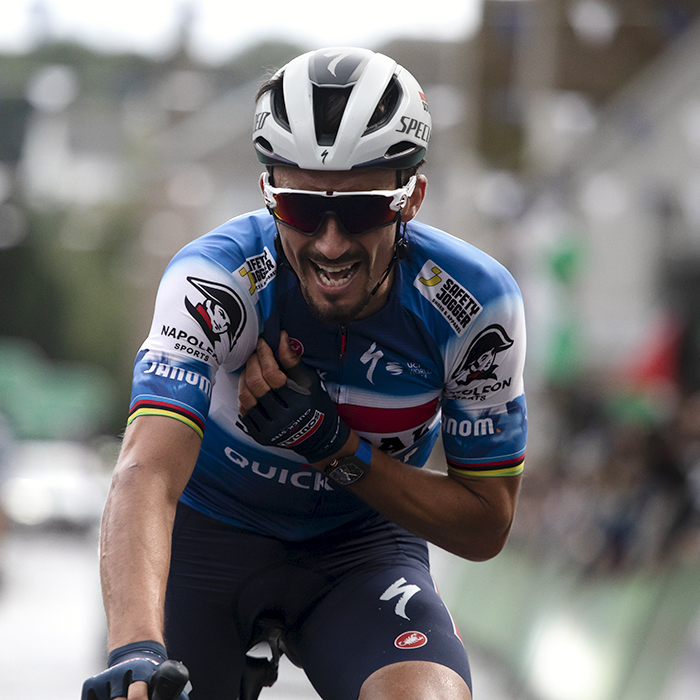 Tour of Britain 2024 - A joyous Julian Alaphilippe talks into his team radio following their victory in Kelso