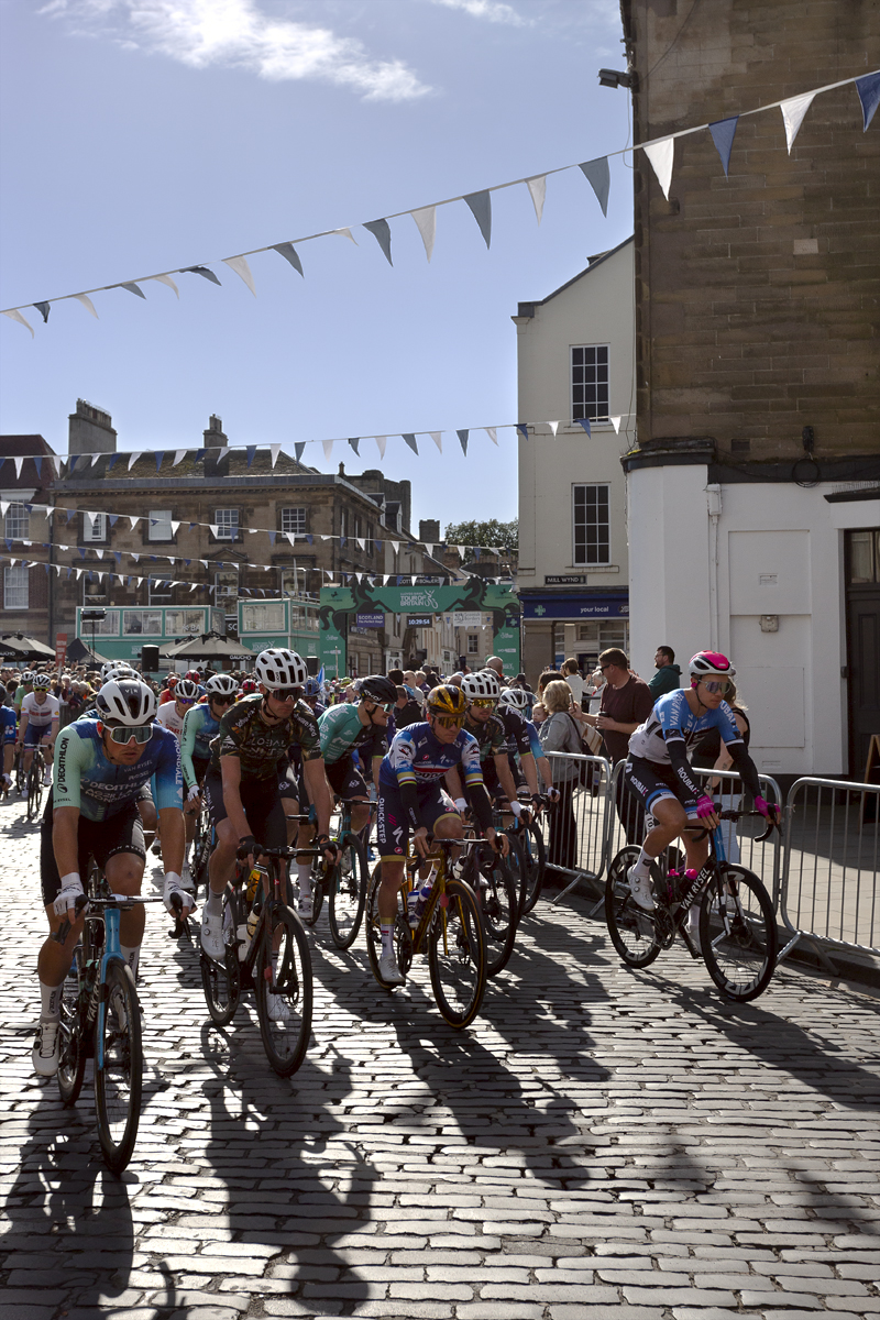 Tour of Britain 2024 - The race sets off basking in late summer sunshine from the town of Kelso in the Scottish Borders