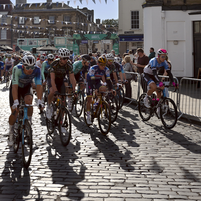 Tour of Britain 2024 - The race sets off basking in late summer sunshine from the town of Kelso in the Scottish Borders