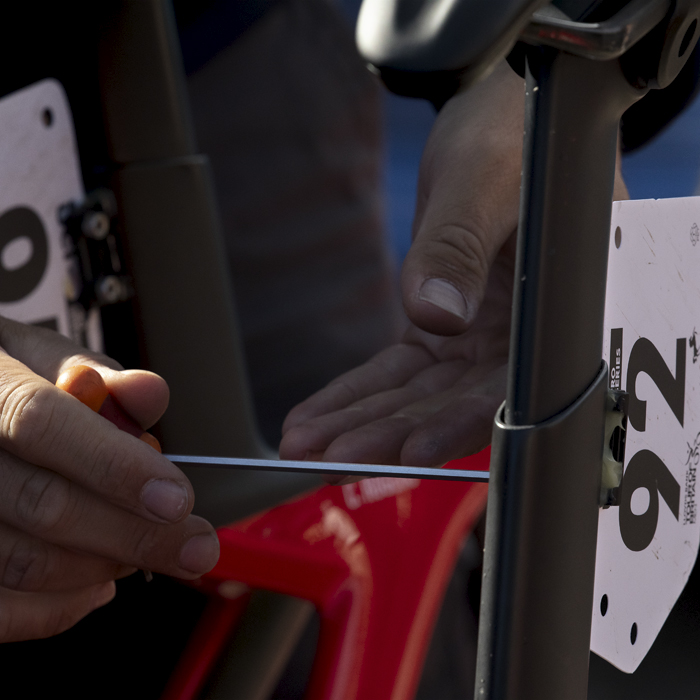 Tour of Britain 2024 - A mechanic makes last minute adjustments to Martin Pedersen’s bike