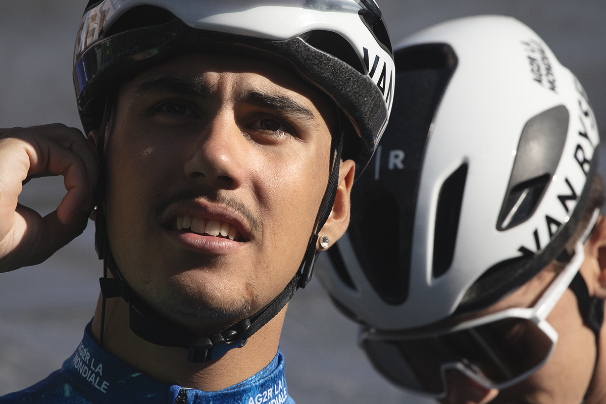 Tour of Britain 2024 - Noa Isidore of AGR2 Development team checks his earpiece before the race starts