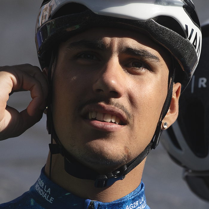 Tour of Britain 2024 - Noa Isidore of AGR2 Development team checks his earpiece before the race starts