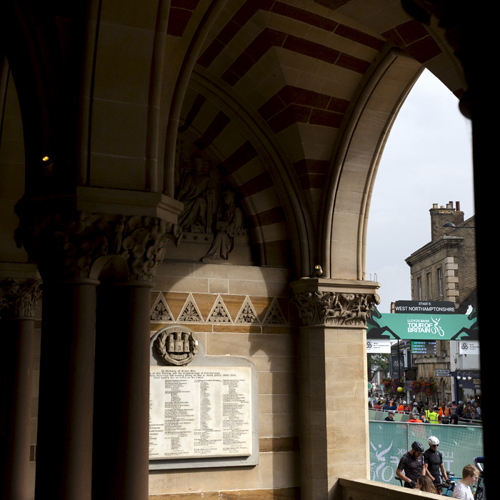 Tour of Britain 2024 - The finish gate at Northampton viewed through the arched doorway of the town hall