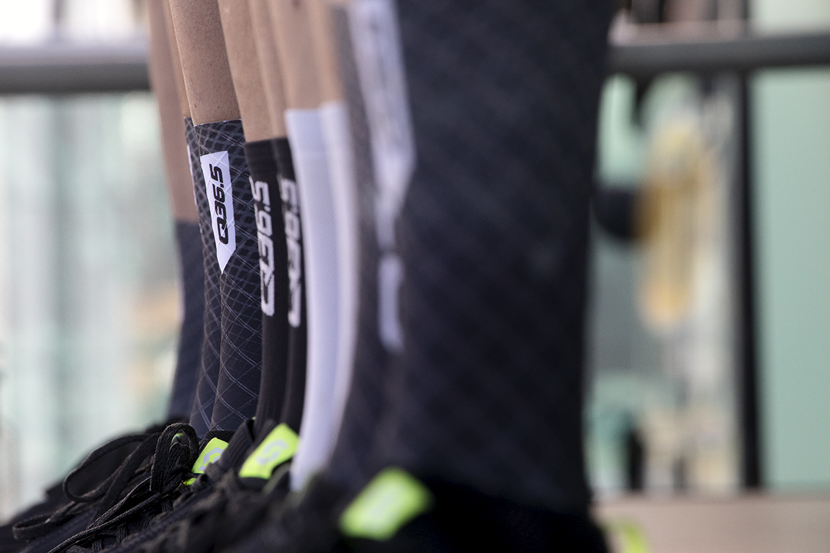 Tour of Britain 2024 - The socks of Q36.5 team with the sponsor logo on them as they line up on the podium before the race