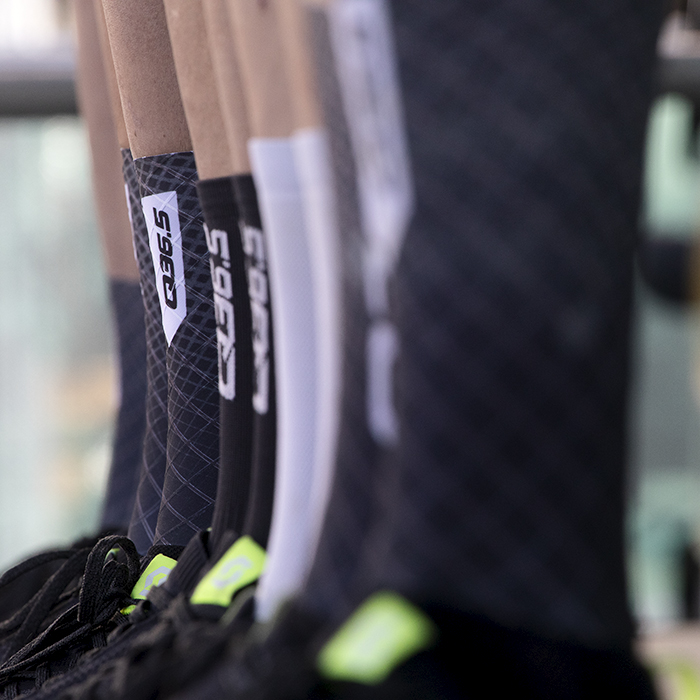 Tour of Britain 2024 - The socks of Q36.5 team with the sponsor logo on them as they line up on the podium before the race