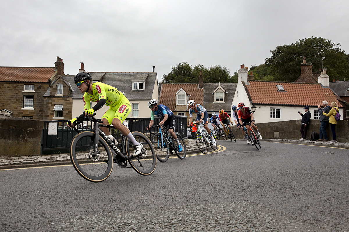 Tour of Britain 2024 - Riders cross a bridge in Sandsend on Stage 2 of the race