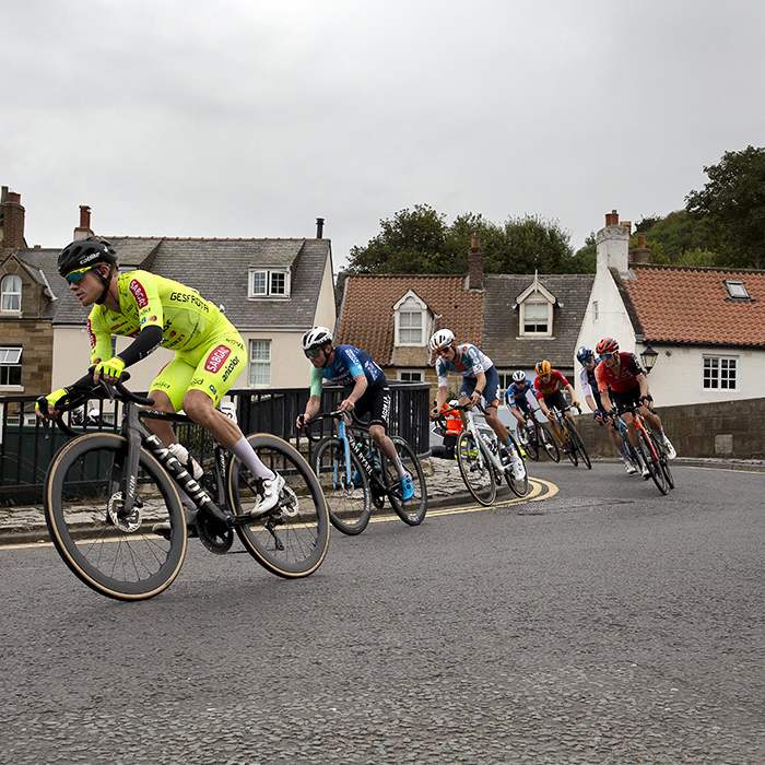 Tour of Britain 2024 - Riders cross a bridge in Sandsend on Stage 2 of the race