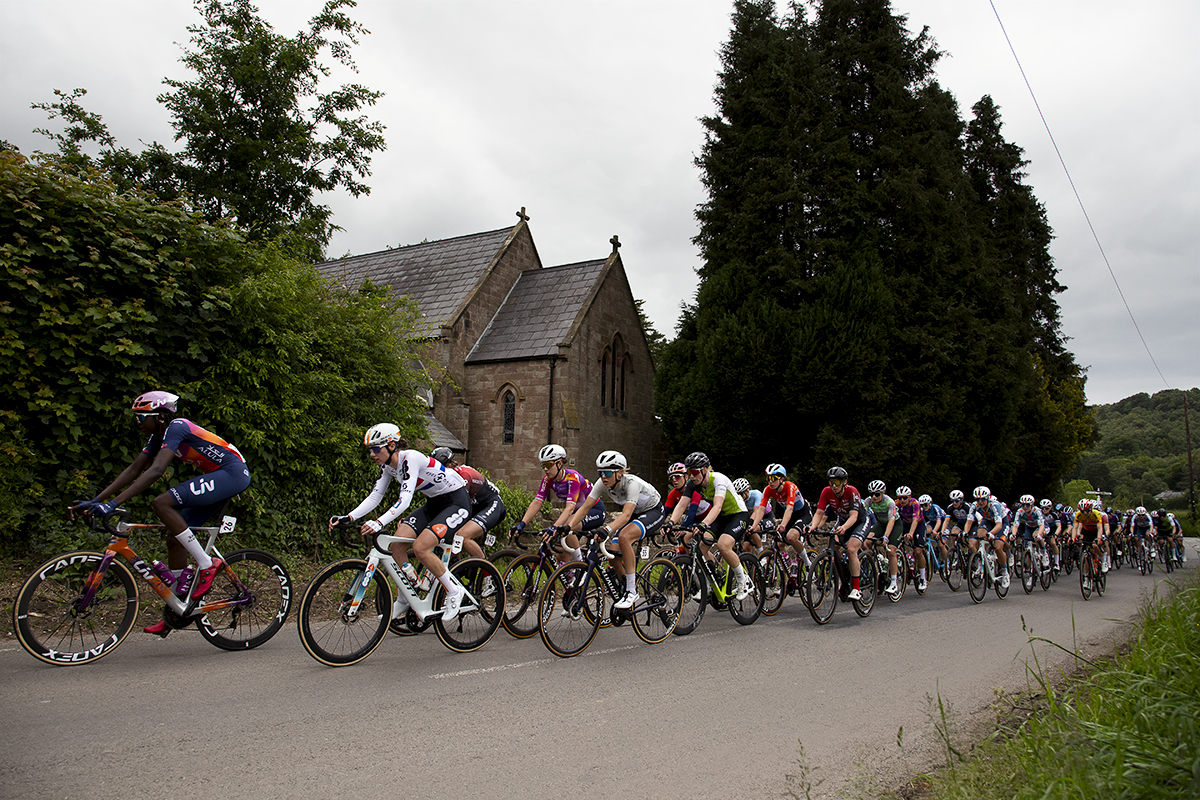 Tour of Britain Women’s 2024 - Teniel Campbell leads the peloton past Bickerton church on stage 2 of the race