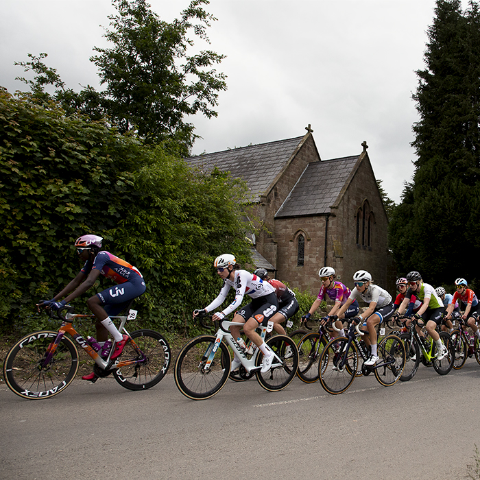 Tour of Britain Women’s 2024 - Teniel Campbell leads the peloton past Bickerton church on stage 2 of the race