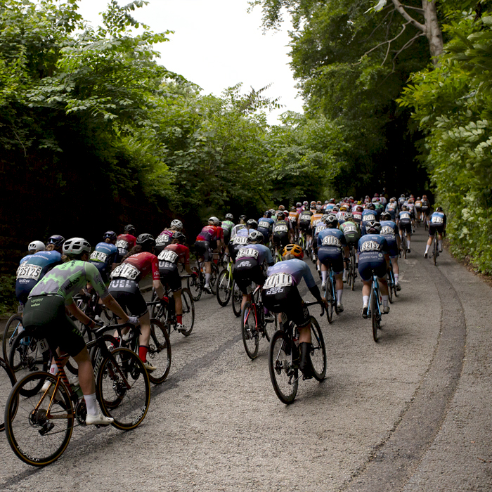 Tour of Britain Women’s 2024 - A group of riders takes on the short climb towards Gresford