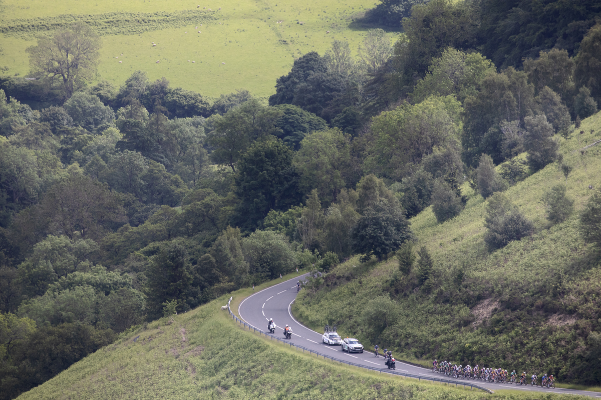 Tour of Britain Women’s 2024 - Riders seen from a distance taking on Horseshoe Pass