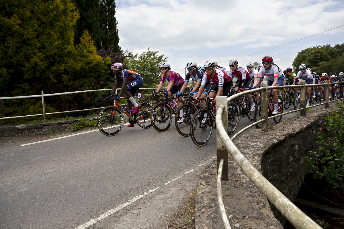 Tour of Britain Women’s 2024 - Riders cross a small bridge at Llanfyllin