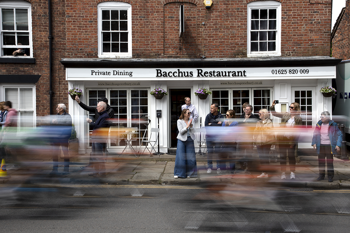 Tour of Britain Women’s 2024 - Riders speed past Bacchus Restaurant in The Village