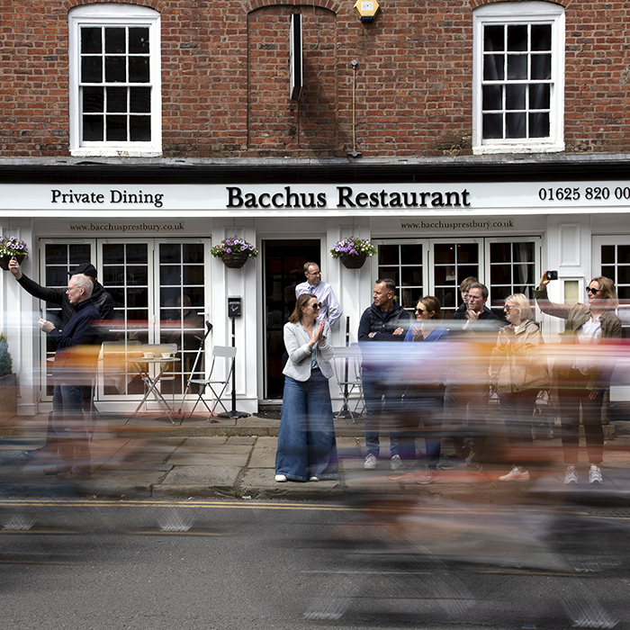 Tour of Britain Women’s 2024 - Riders speed past Bacchus Restaurant in The Village