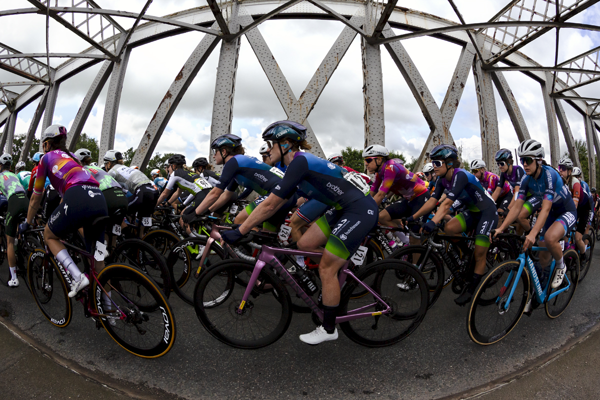 Tour of Britain Women’s 2024 - Riders seen from the side as they cross an old swing bridge in Warrington