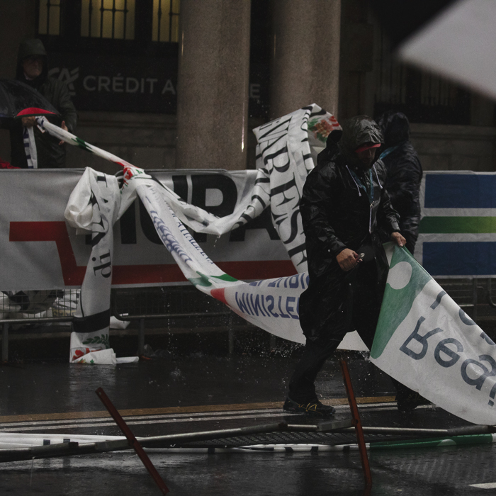 Tre Valli Varesine 2024 - Varese - Race officials battle the elements as they remove elements of the course damaged by the weather