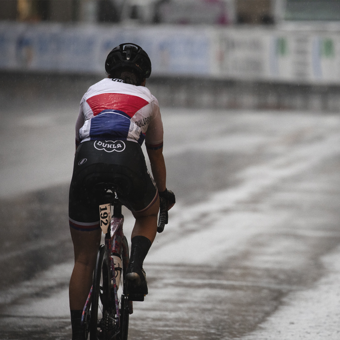 Tre Valli Varesine Women’s Race 2024 - Barbora Němcová wearing a rain jacket heads back to the buses having abandoned the race