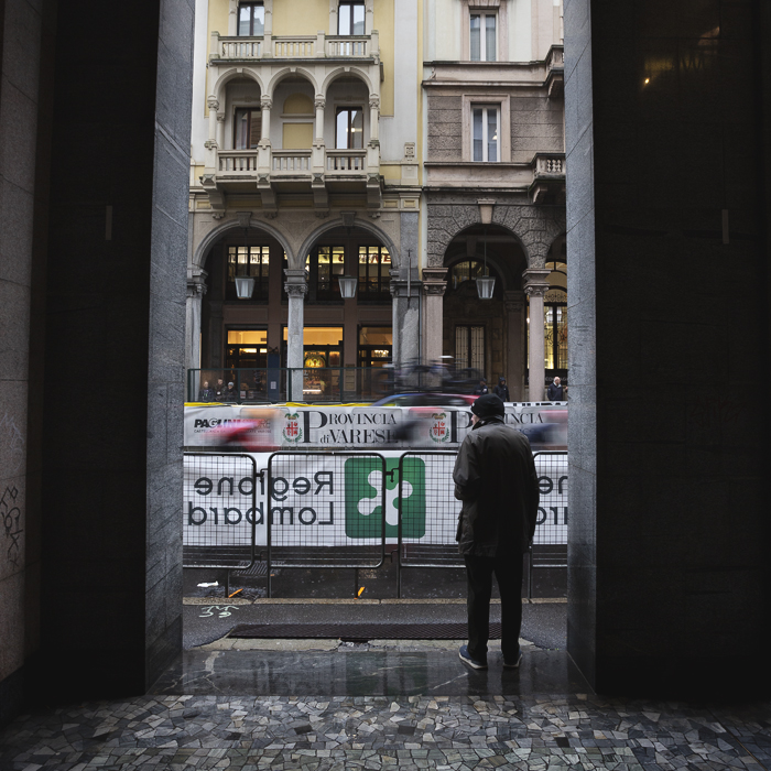 Tre Valli Varesine Women’s Race 2024 - Varese - Banners advertising the Provincia di Varese seen through the archway of a colonnade