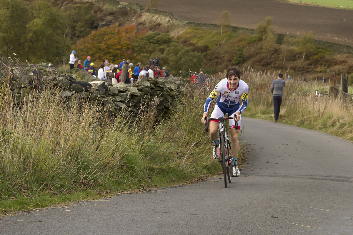 UK National Hill Climb Championships 2015 - Glyndwr Griffiths stands on his pedals and grimaces with effort as he climbs through the Yorkshire countryside