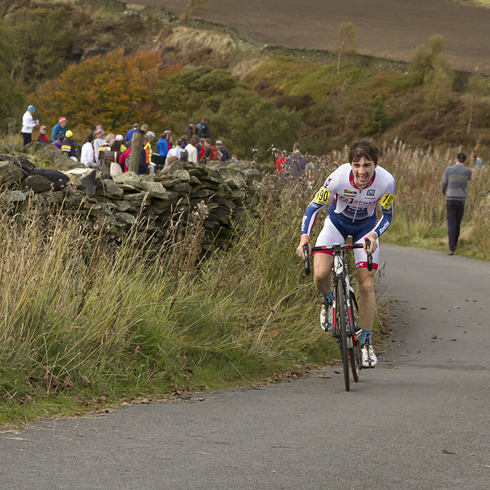 UK National Hill Climb Championships 2015 - Glyndwr Griffiths stands on his pedals and grimaces with effort as he climbs through the Yorkshire countryside