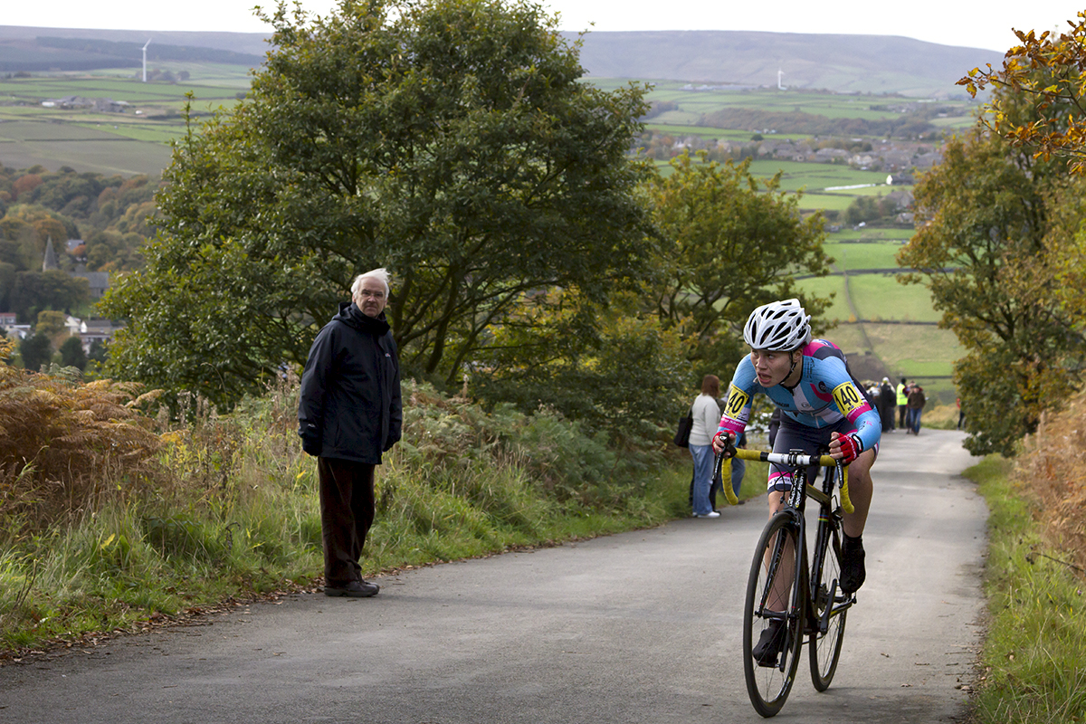 UK National Hill Climb Championships 2015 - Henrietta Colborne glances up the hill while a fan watches on