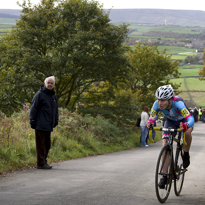 UK National Hill Climb Championships 2015 - Henrietta Colborne glances up the hill while a fan watches on