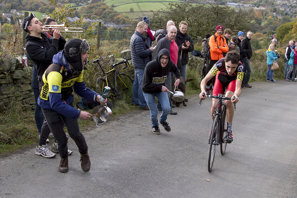 UK National Hill Climb Championships 2015 - Fans banging pans run with Jack O’Neil while another plays a small trombone