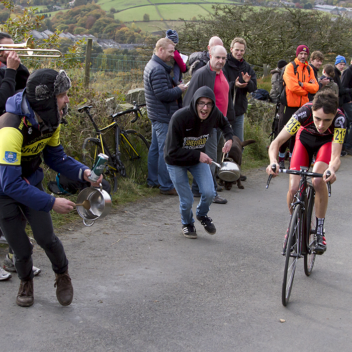 UK National Hill Climb Championships 2015 - Fans banging pans run with Jack O’Neil while another plays a small trombone