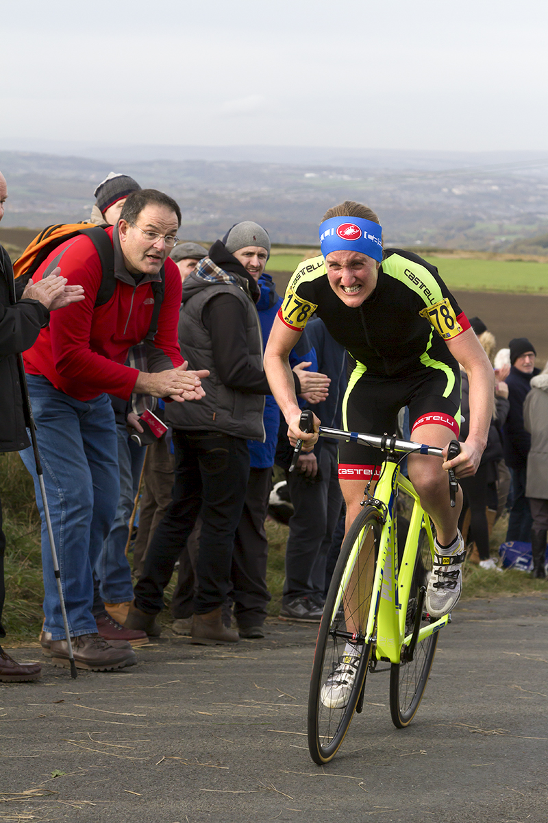 UK National Hill Climb Championships 2015 - Lou Bates grimaces in effort as a fan applauds