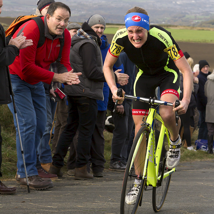 UK National Hill Climb Championships 2015 - Lou Bates grimaces in effort as a fan applauds