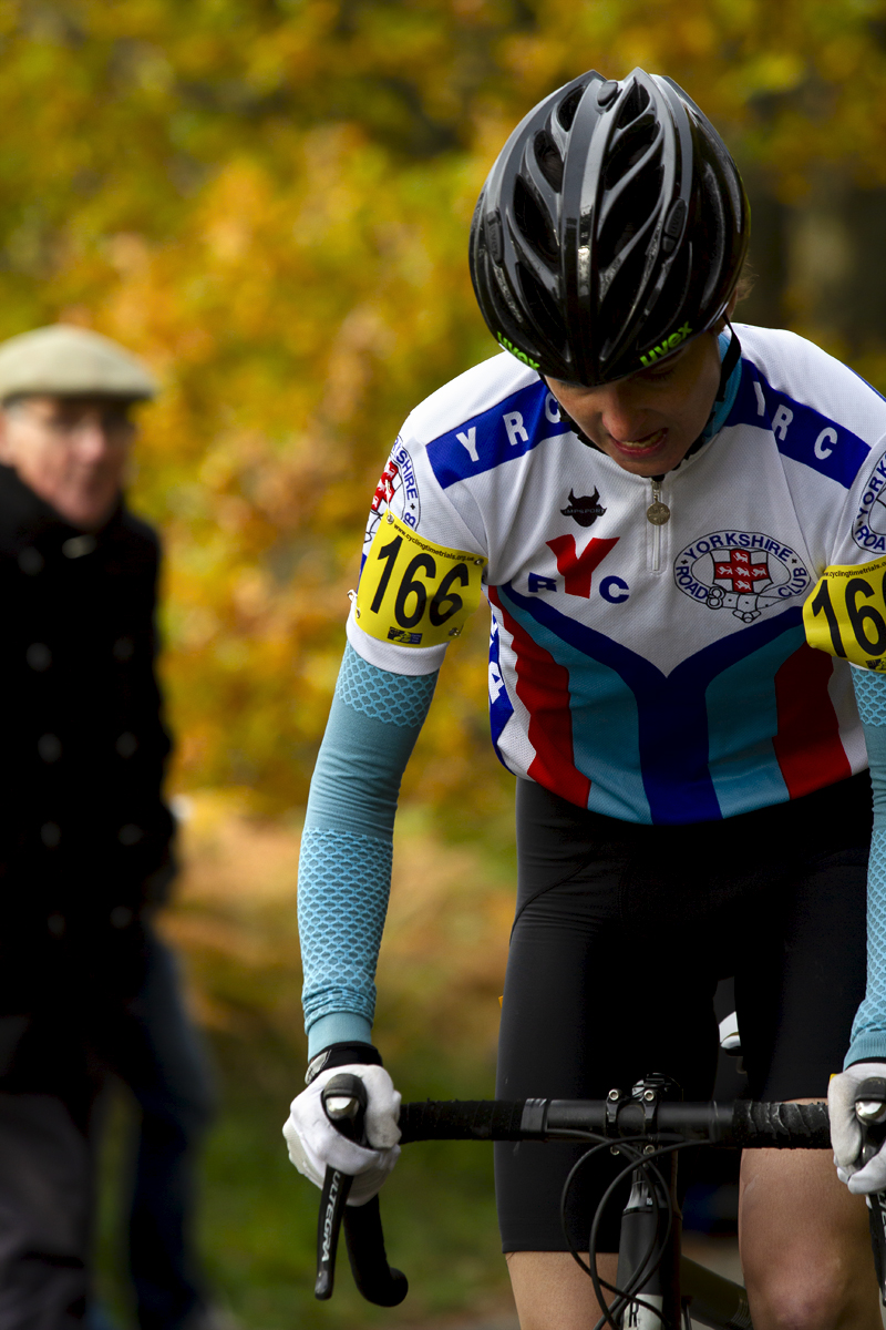 UK National Hill Climb Championships 2015 - Mary Wilkinson pushes on up the hill with autumnal colours behind her