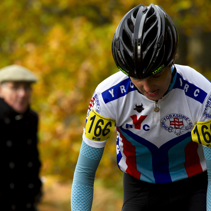 UK National Hill Climb Championships 2015 - Mary Wilkinson pushes on up the hill with autumnal colours behind her