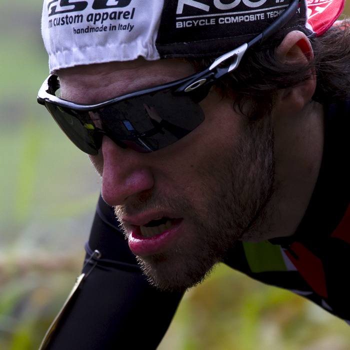 UK National Hill Climb Championships 2015 - Mathew Cartlidge wearing sunglasses with a small cycling cap on backwards