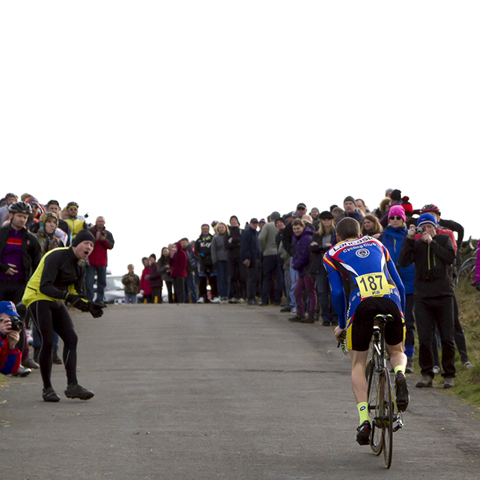 UK National Hill Climb Championships 2015 - Thomas Brook seen from behind as he climbs to the finish while fans line the roadside