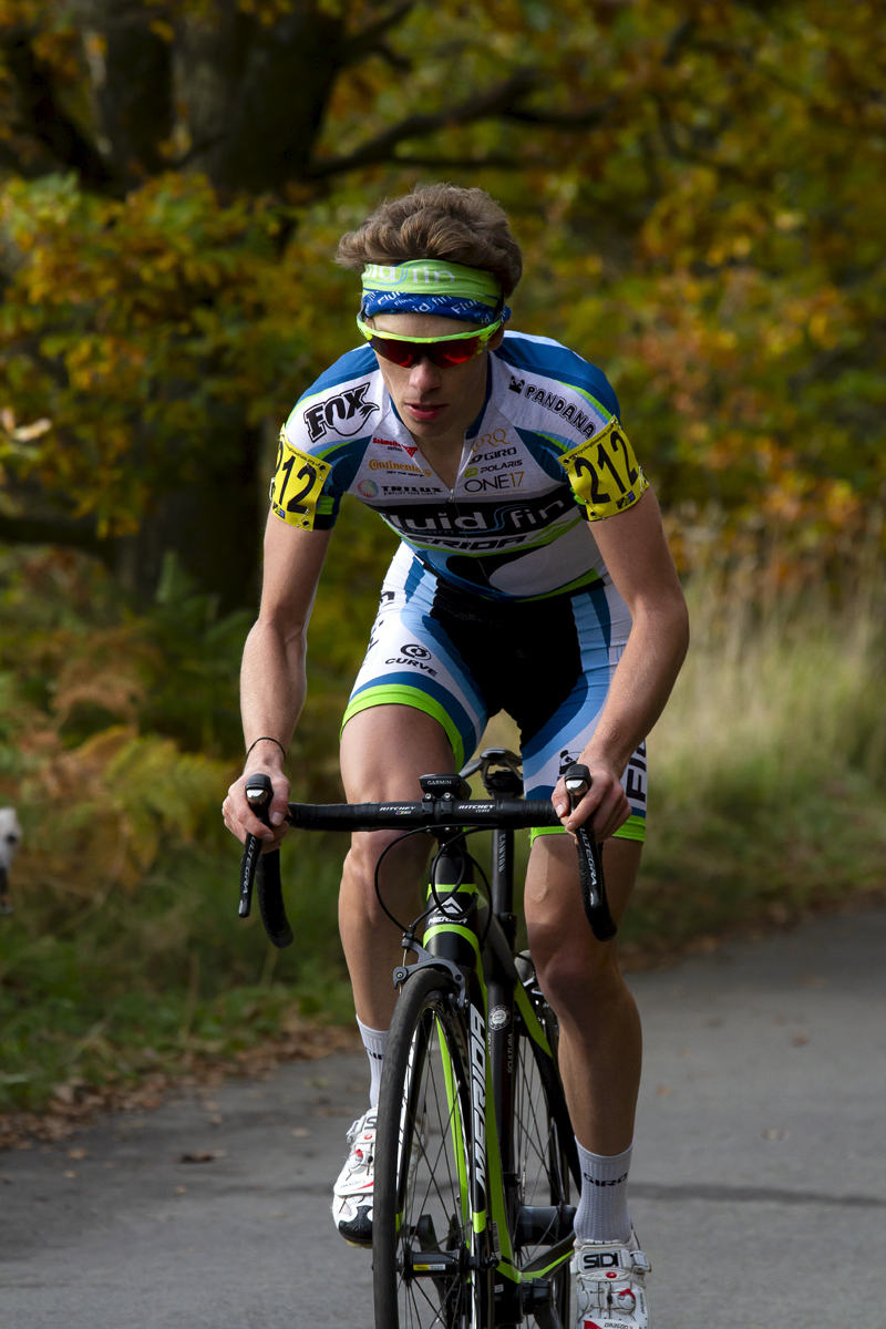 UK National Hill Climb Championships 2015 - Tom Bell wearing green sunglasses and headband climbs the hill