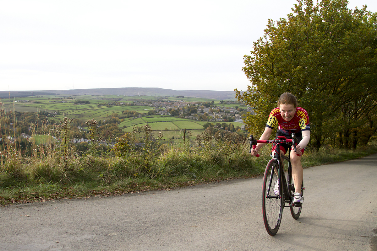 UK National Hill Climb Championships 2015 - Wiebke Rietz tackles the climb with the beautiful Yorkshire countryside behind her