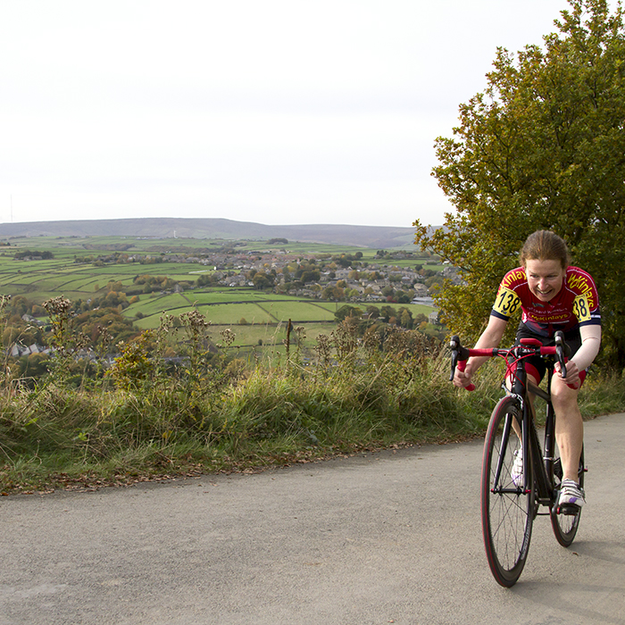 UK National Hill Climb Championships 2015 - Wiebke Rietz tackles the climb with the beautiful Yorkshire countryside behind her