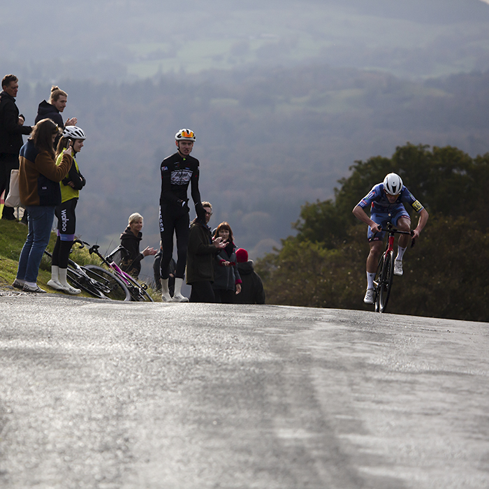 UK National Hill Climb Championships 2023 - Ben Millar puts his head down as he passes a group of supporters