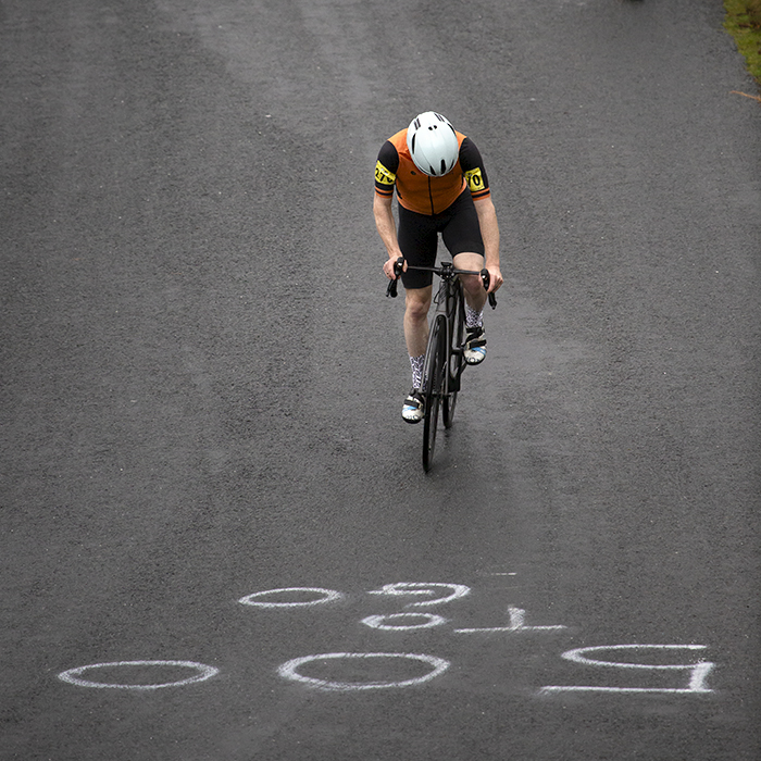 UK National Hill Climb Championships 2023 - Bruce Morris from above as he approaches writing on the road reading 500 To Go