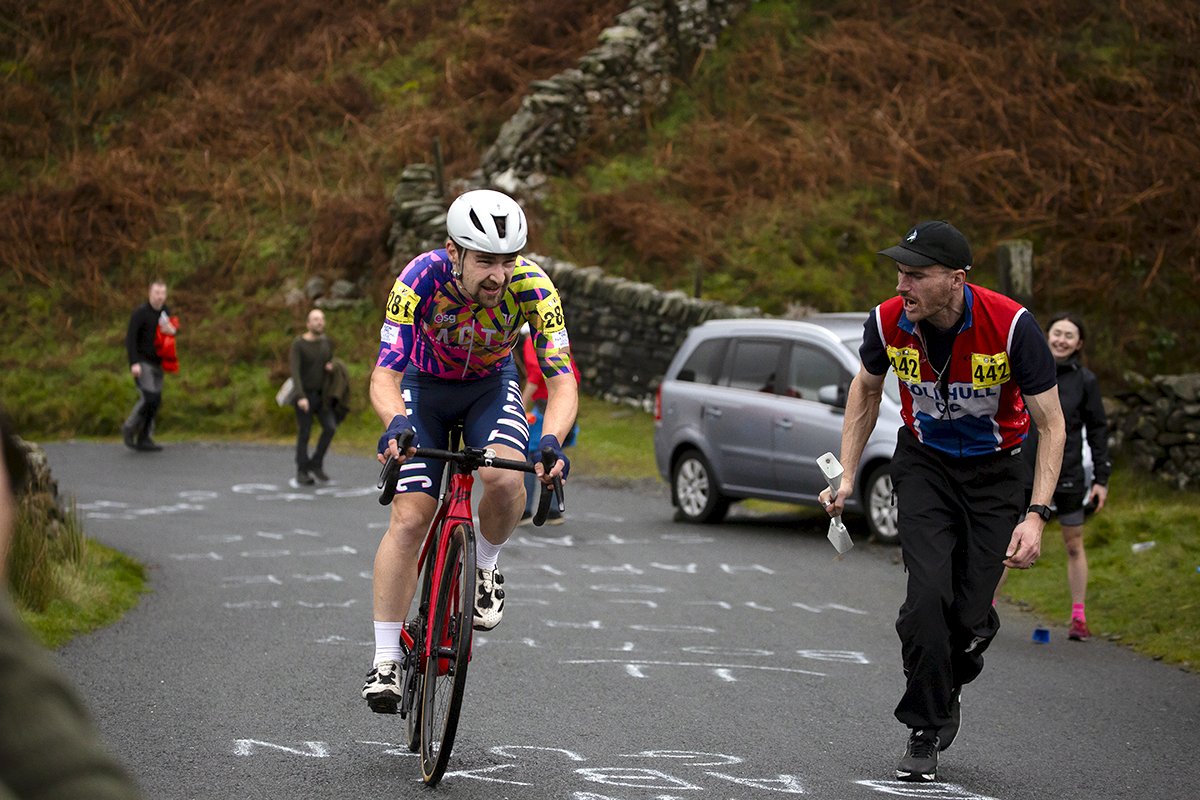 UK National Hill Climb Championships 2023 - A supporter runs alongside James Claydon during his climb