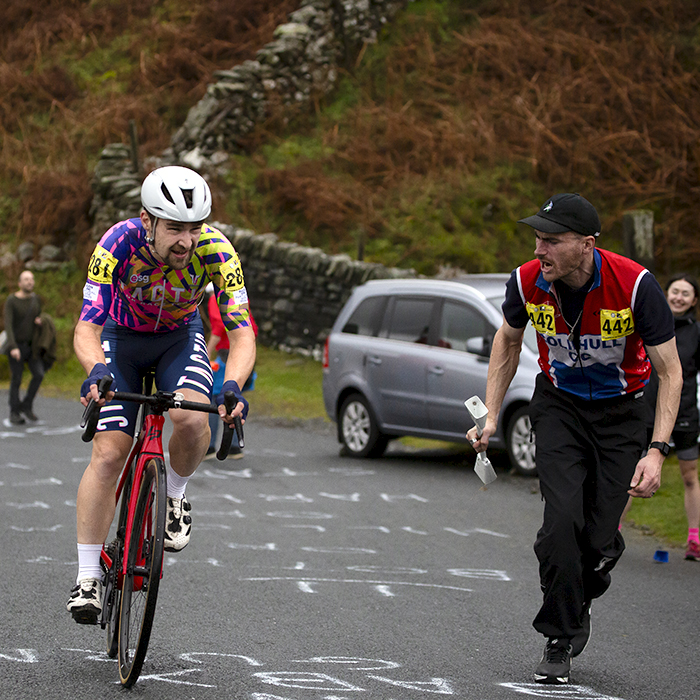 UK National Hill Climb Championships 2023 - A supporter runs alongside James Claydon during his climb