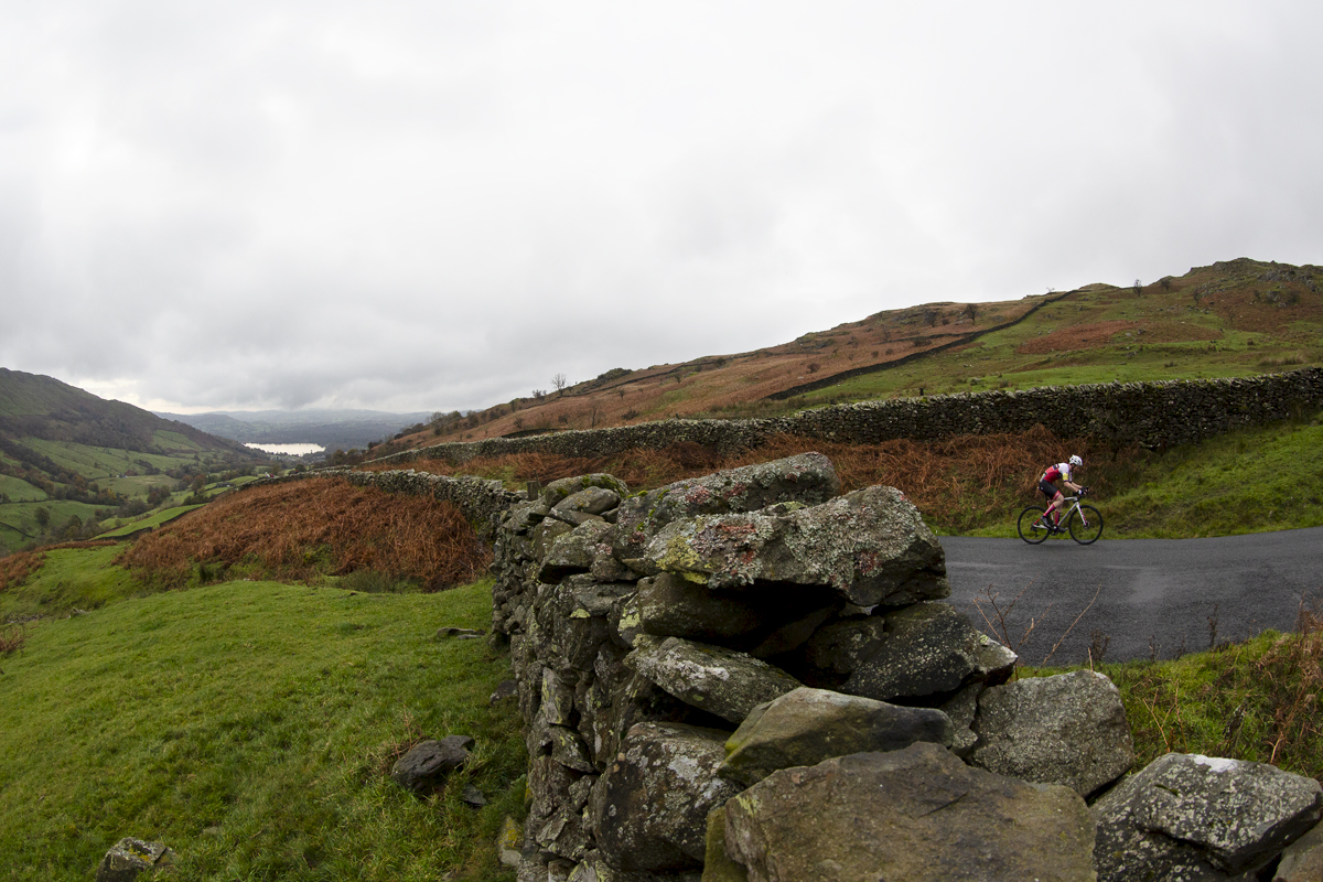 UK National Hill Climb Championships 2023 - Jonathan Hobbs is framed by dry stone walls on his way up the climb