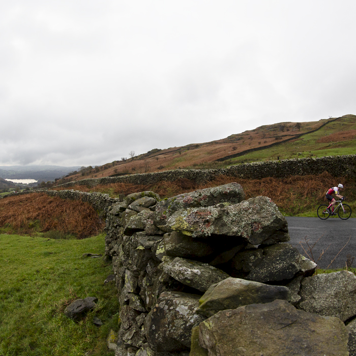 UK National Hill Climb Championships 2023 - Jonathan Hobbs is framed by dry stone walls on his way up the climb