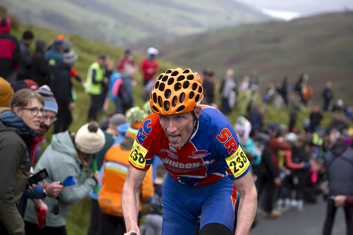 UK National Hill Climb Championships 2023 - Marc Allen sticks out his tongue and makes one final effort on his way to the finish