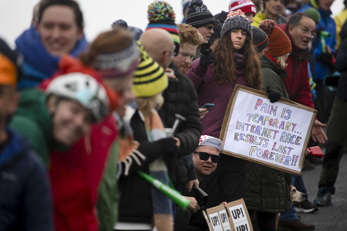 UK National Hill Climb Championships 2023 - A supporter holds a sign that reads Pain Is Temporary, Internet Race Results Last Forever!!