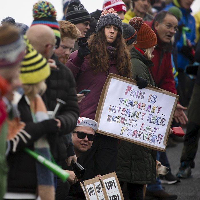 UK National Hill Climb Championships 2023 - A supporter holds a sign that reads Pain Is Temporary, Internet Race Results Last Forever!!