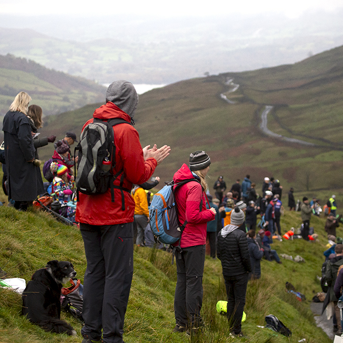 UK National Hill Climb Championships 2023 - Supporters on the hillside overlook the road and offer encouragement to riders making their way up The Struggle